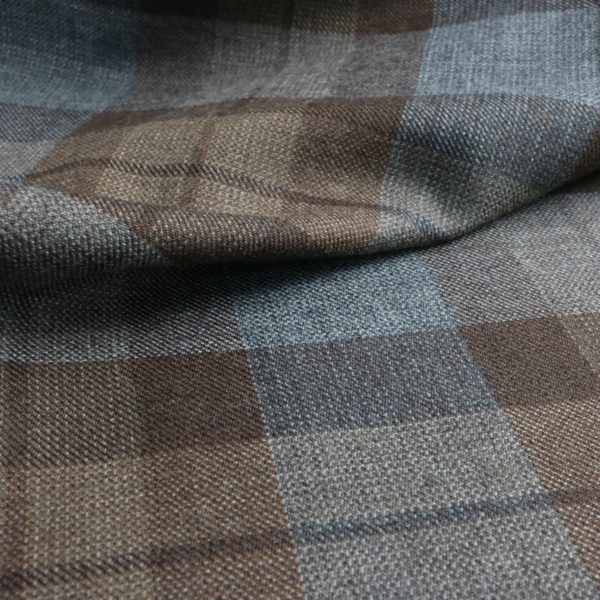 A close up of a brown OUTLANDER Authentic Premium Wool Tartan fabric.