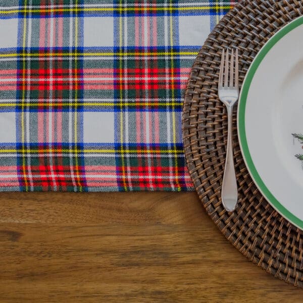 A Reversible Tartan Placemat - Homespun Wool Blend with a plaid napkin and fork on a wooden table.