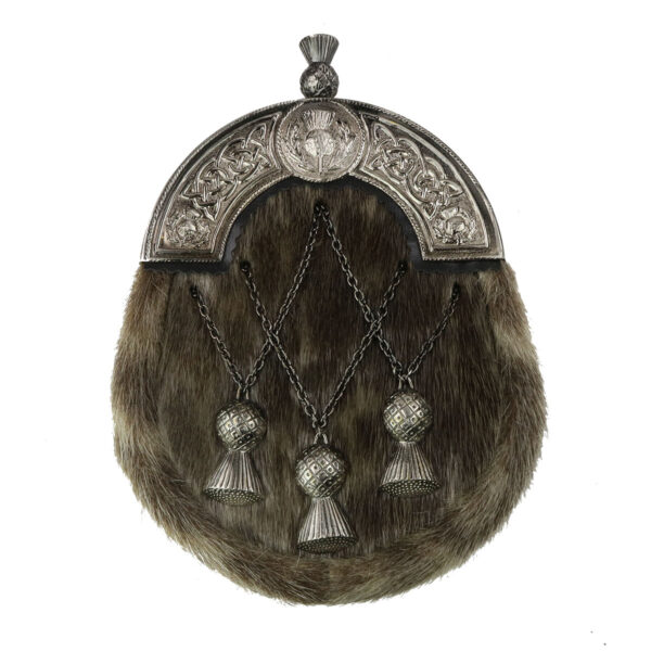A silver and fur scottish kilt bag with tassels.