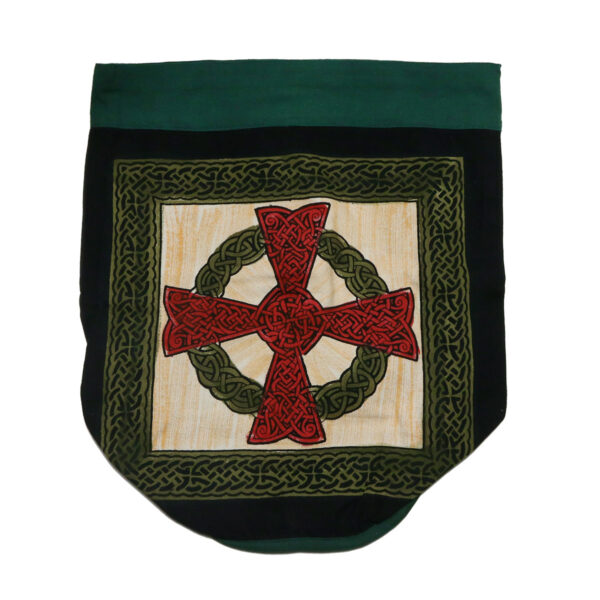 A Green Celtic Cross Backpack hanging on a black background, available for purchase as a backpack or tote.