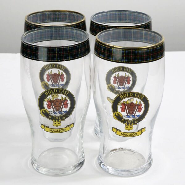 A set of three MacLeod of Lewis Clan Crest tartan pub glasses.