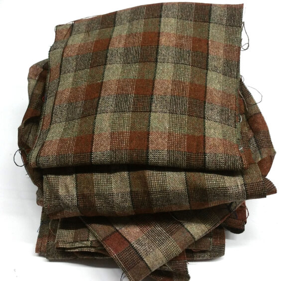 A pile of Braveheart Movie Tartan Craft Box fabric in brown and tan, reminiscent of the Braveheart movie.