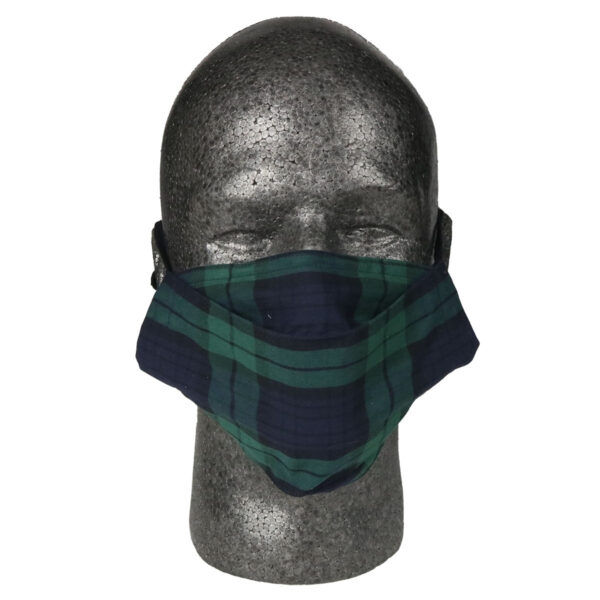 A mannequin showcasing an Origami Outlander Tartan Mask - Wool Free, adorned with a tasteful green and black plaid pattern.