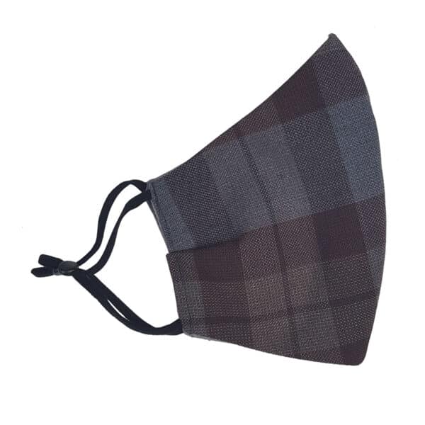 An Outlander Tartan Face Mask - Wool Free with a black cord.