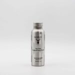 A bottle of deer antler oil, infused with Nutdust - Voyager, on a white background.