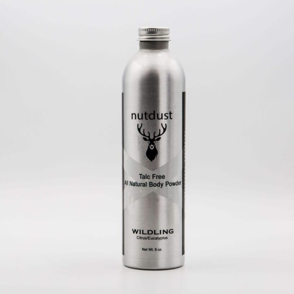 A bottle of Nutdust - Wildling body powder on a white background.