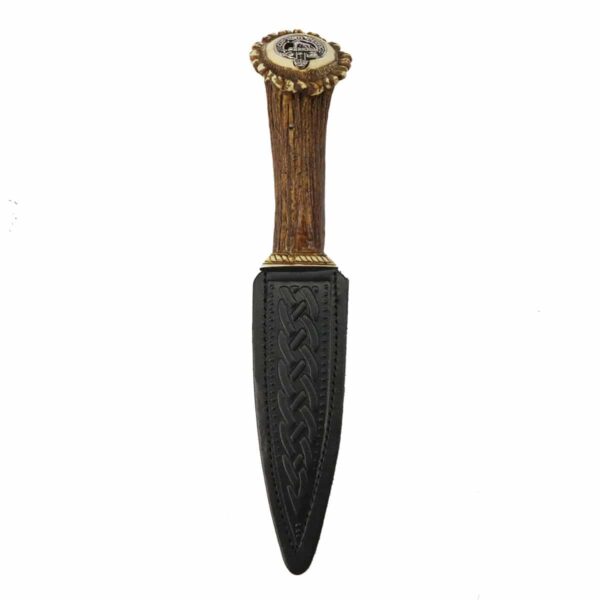 A Clan Crest Stag Handle Sgian Dubh with a black handle and gold accents.