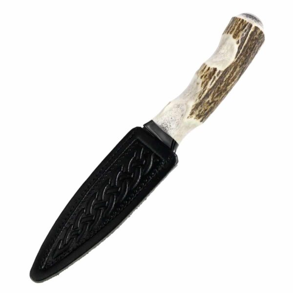 A black and white handle Stag Antler Damascus Steel Sgian Dubh with a stag antler design.