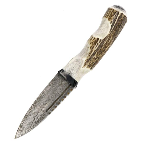 A Stag Antler Damascus Steel Sgian Dubh with antlers on it.