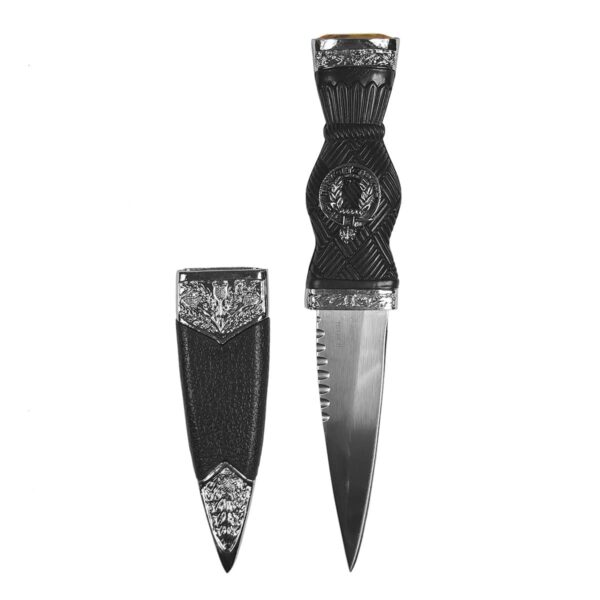 A black and silver MacArthur Pewter Thistle Clan Crest Sgian Dubh with a yellow gem on a white background.