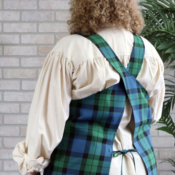 The back of a woman wearing a Tartan Cross Back Apron - Homespun Wool Blend.