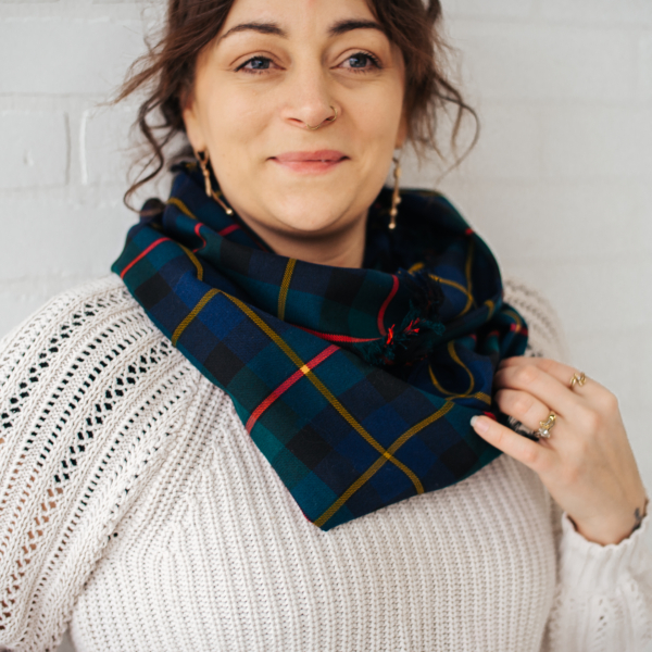 A woman wearing a Tartan Scarf - 13oz Premium Wool.