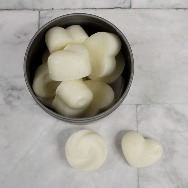Heart-shaped soap cubes in a metal tin, perfect for Homemade Candles.