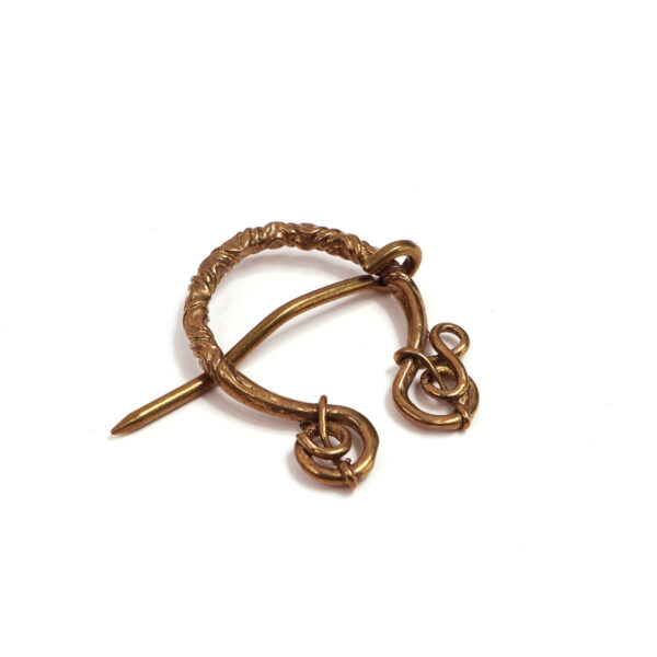 The Entangled Brass Penannular Brooch has two rings on it.